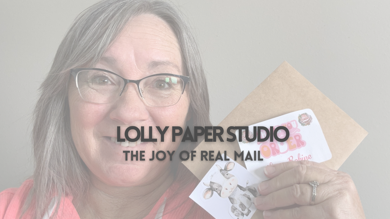 Handmade greeting card with decorative stickers from an independent paper studio, photographed on desk